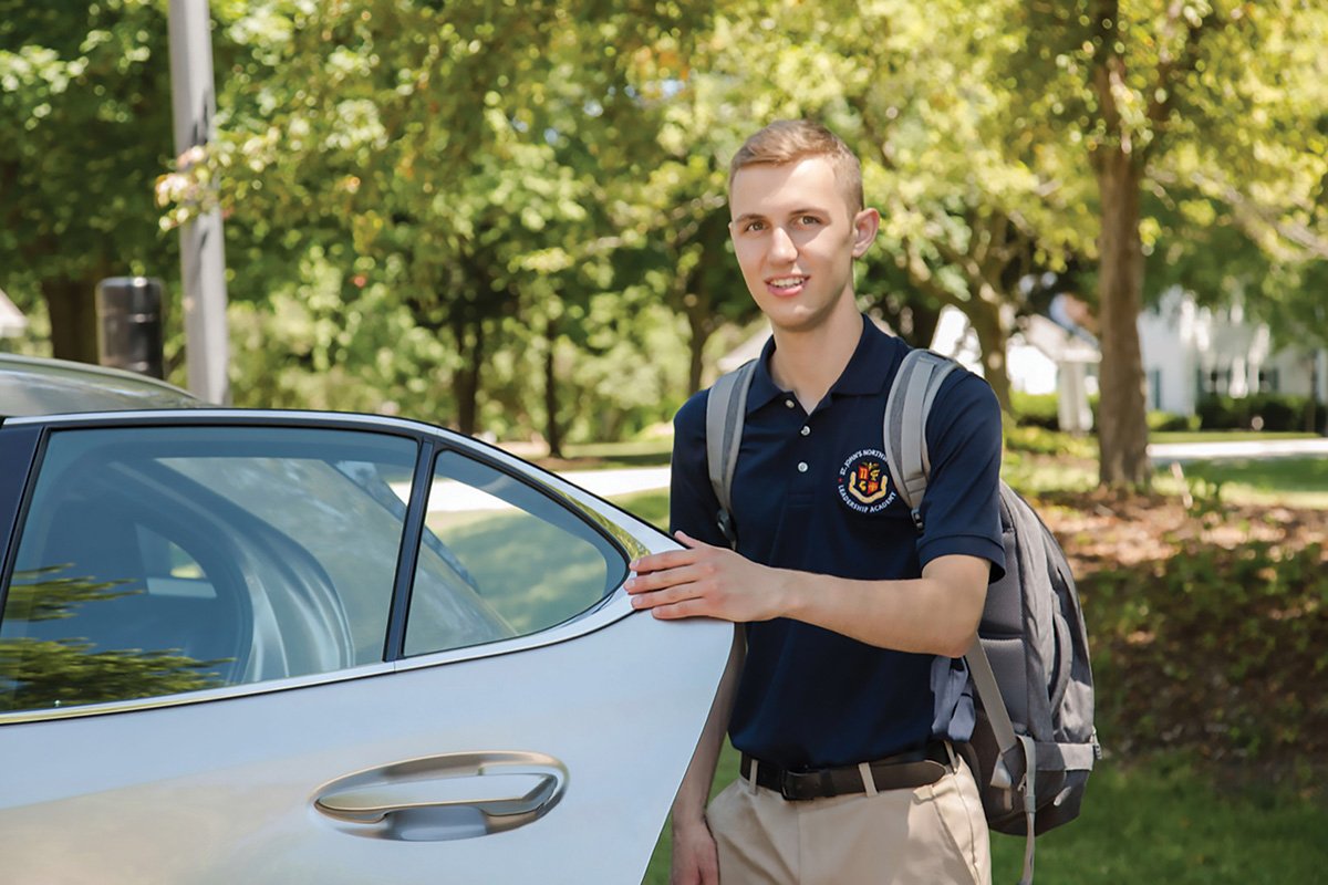 Student getting out of car