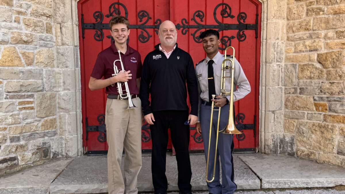 Students Mayers and Hardbarger pose with their instruments