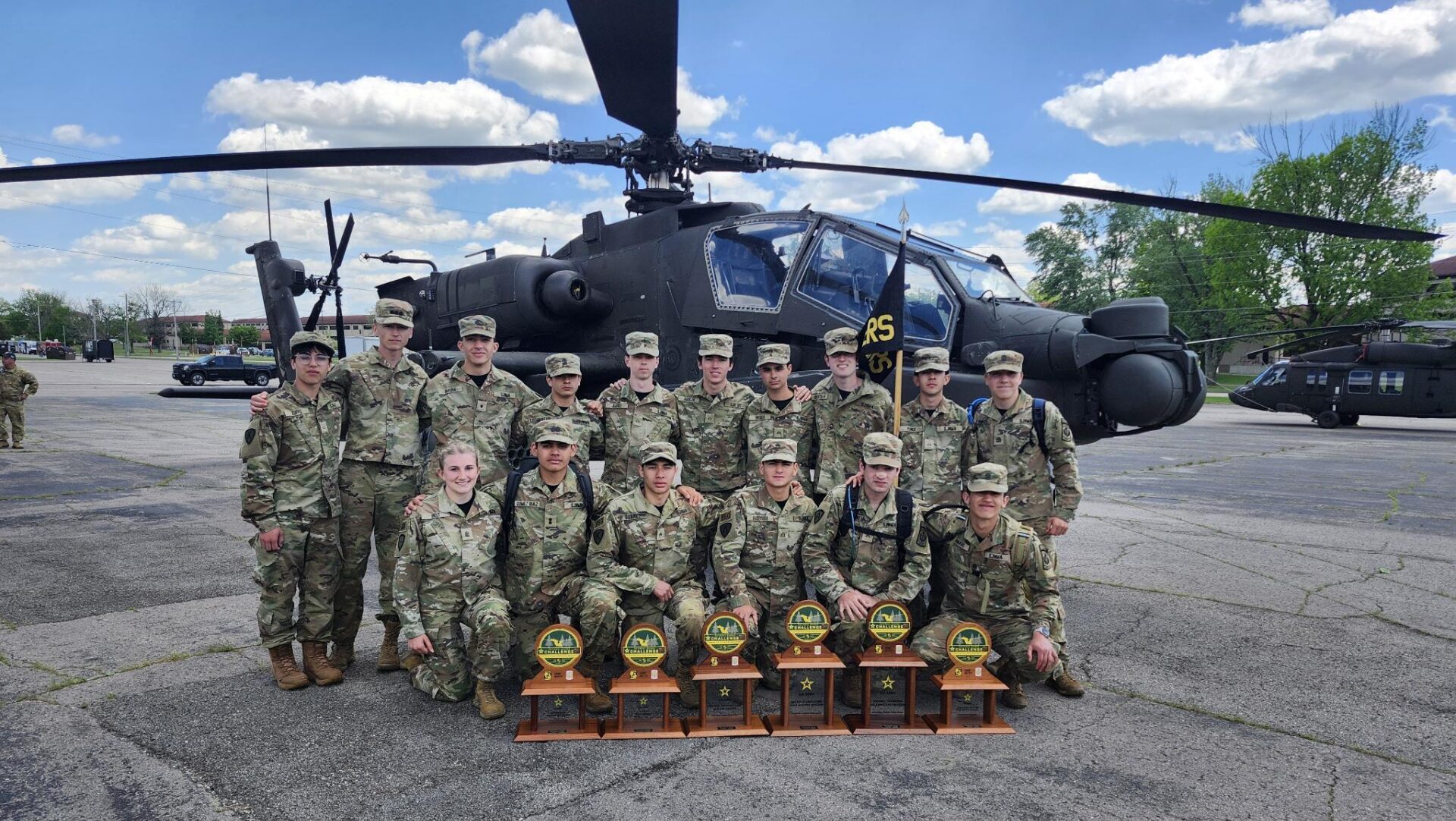 SJN poses in front of a helicopter